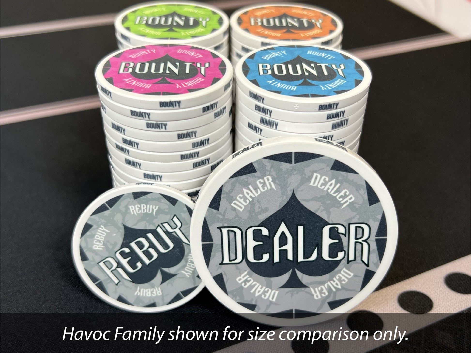 Also available for your Havoc Dealer Button: matching bounty chips and rebuy chips. Shown are the 43mm gray Havoc Rebuy Chip and the multi-colored 39mm Havoc Bounty Chips. A 49mm dealer button is also available, but not shown.