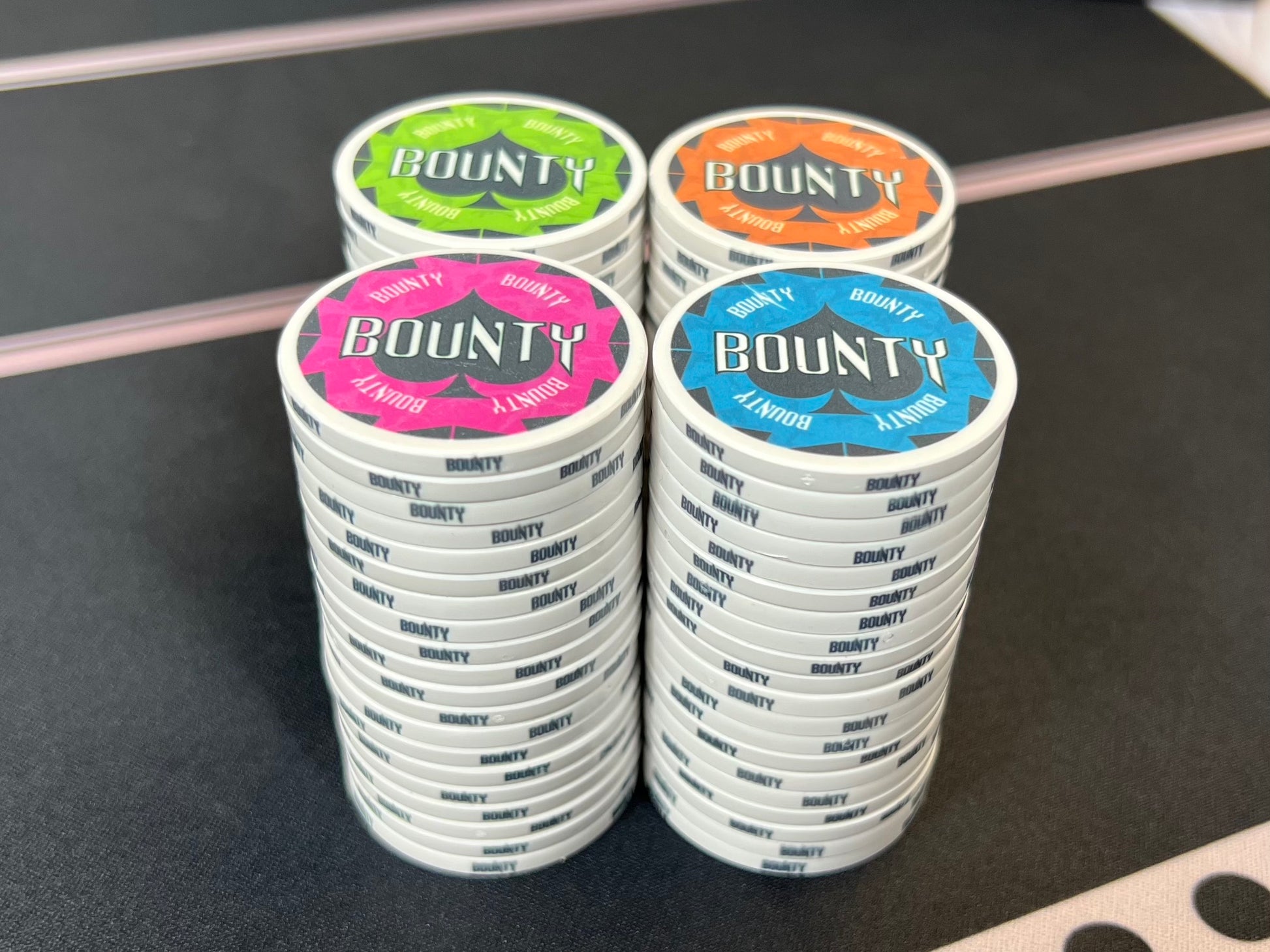 A straight-on view of the Havoc Bounty poker chips stacked up. The colors are so bright, they almost seem to glow on the table, which makes it easy to keep them separate from your poker tournament chips.