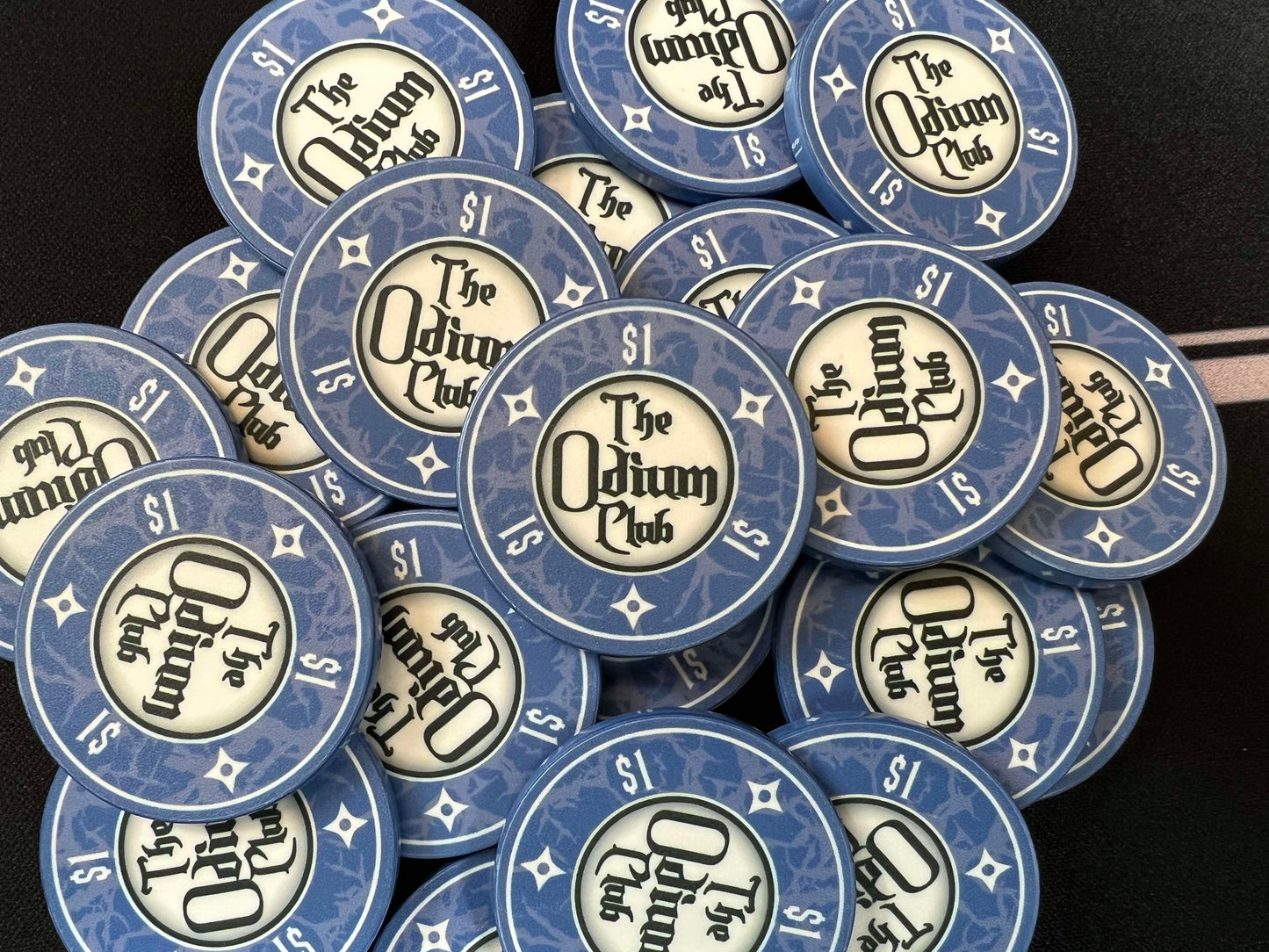 Shown here are the Odium Club 1 dollar blue poker chips in a large pot. These are 39mm chips (actually closer to 40mm), American casino size poker chips. They are the classic poker chip thickness of 3.3mm or 0.13 inches. Whether you're playing poker with family and friends and need dollar chips for low stakes games...or whether you're a professional poker player, these chips will get your texas hold'em game started off right.