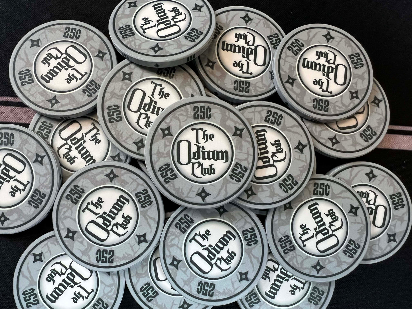Shown here are the Odium Club 25 cent gray poker chips in a poker chip pot. These are 39mm chips (actually closer to 40mm), USA size poker chips. They are the traditional poker chip thickness of 3.3mm or 0.13 inches. Whether you're just getting started in poker and need quarter chips for playing penny stakes...or whether you're a pro poker player, these chips will get your poker game started off right.
