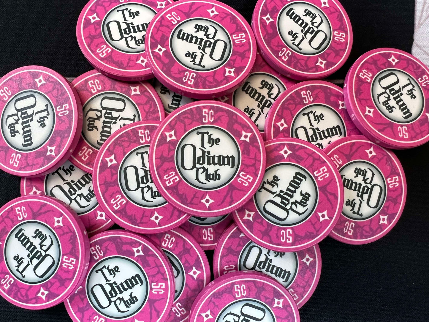 Shown here are the Odium Club 5 cent pink poker chips in a splashed pot. These are 39mm chips (actually closer to 40mm) traditional casino size poker chips. They are the standard poker chip thickness of 3.3mm or 0.13 inches. Whether you're just getting started in poker and need nickel chips for playing micro stakes...or whether you're a professional poker player, these chips will get your texas hold'em game started off right.