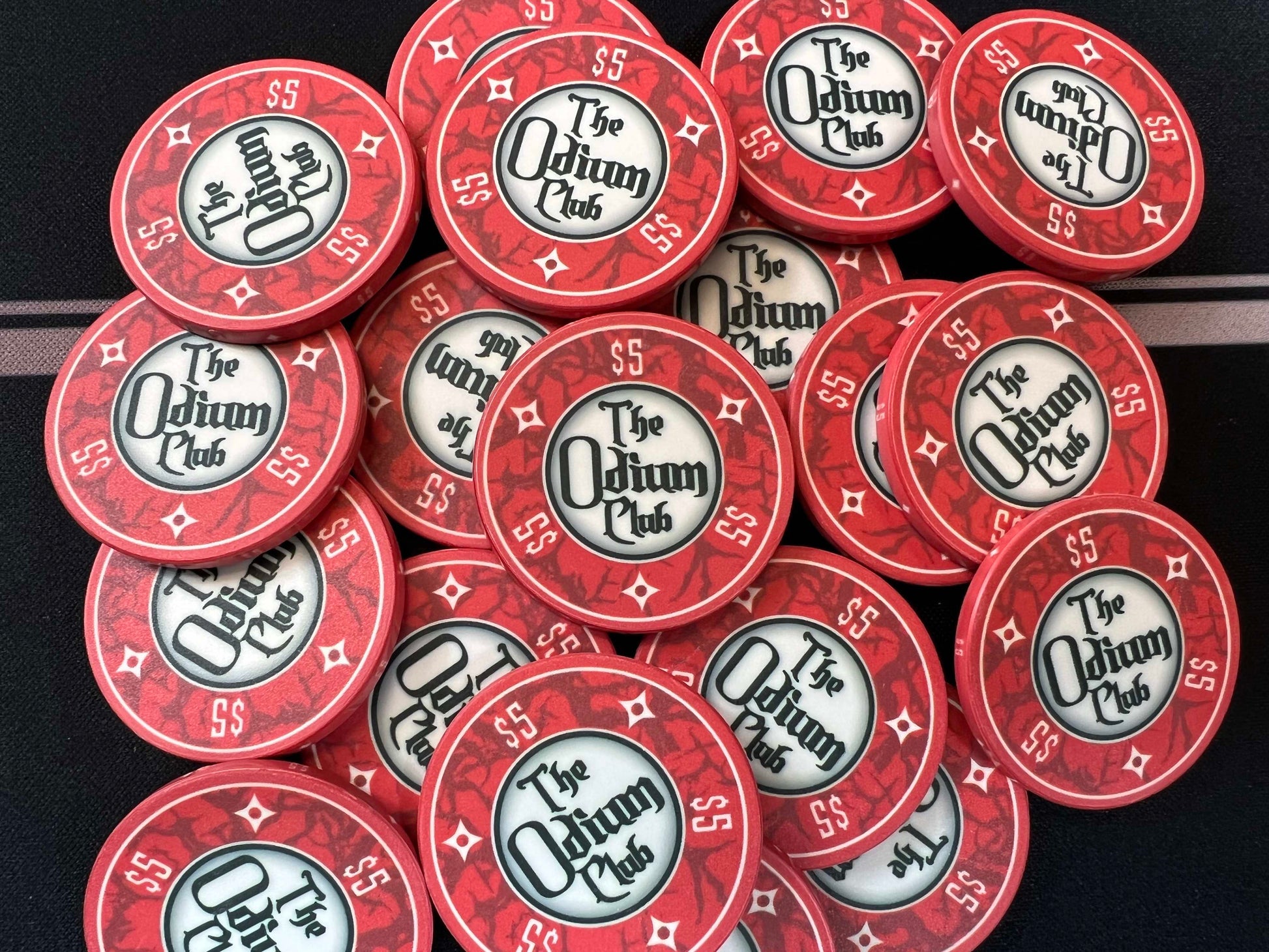Shown here are the Odium Club 5 dollar red poker chips in a big pot. These are 39mm chips (actually closer to 40mm), which are standard casino size poker chips. They are the common poker chip thickness of 3.3mm or 0.13 inches. Whether you're a seasoned player who needs $5 chips for playing mid-stakes poker...or whether you need small denomination chips for casual poker play, these chips will get your hold'em poker game started off right.