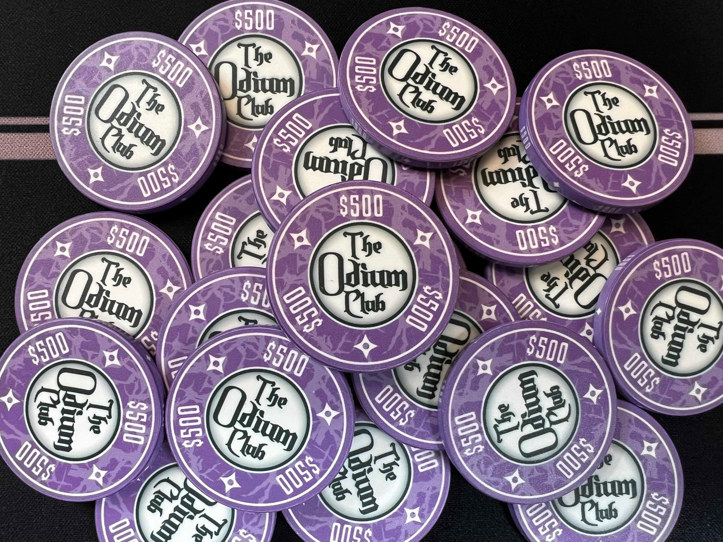 Shown here are the Odium Club 500 dollar purple poker chips shown in a big chip pot. These are 39mm chips (actually closer to 40mm) or "casino size poker chips." They are the regular poker chip thickness of 3.3mm or 0.13 inches. Whether you're a super high roller who needs $500 chips to host high-stakes poker games...or whether you're a novice poker player, these are the nicest chips for texas holdem money can buy.