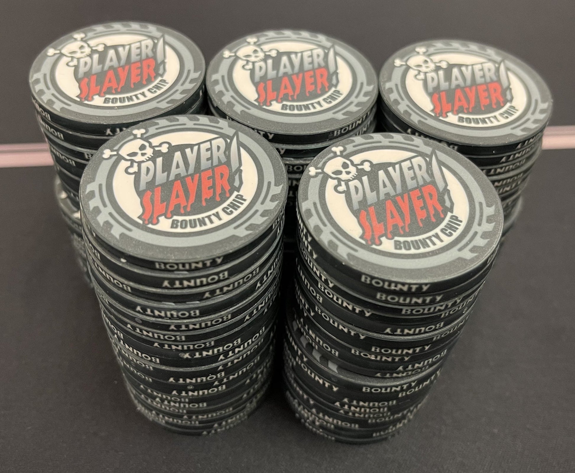 Impress all of your poker party friends with the Player Slayer Bounty Poker Chips to your home poker tourney. These tough-looking poker chips were designed with a cool skull and bloody lettering to reflect the cutthroat nature of poker tournaments. The neutral black, white, gray, and red color scheme matches just about any poker chip set from any online poker chip seller or brick-and-mortar poker supply.
