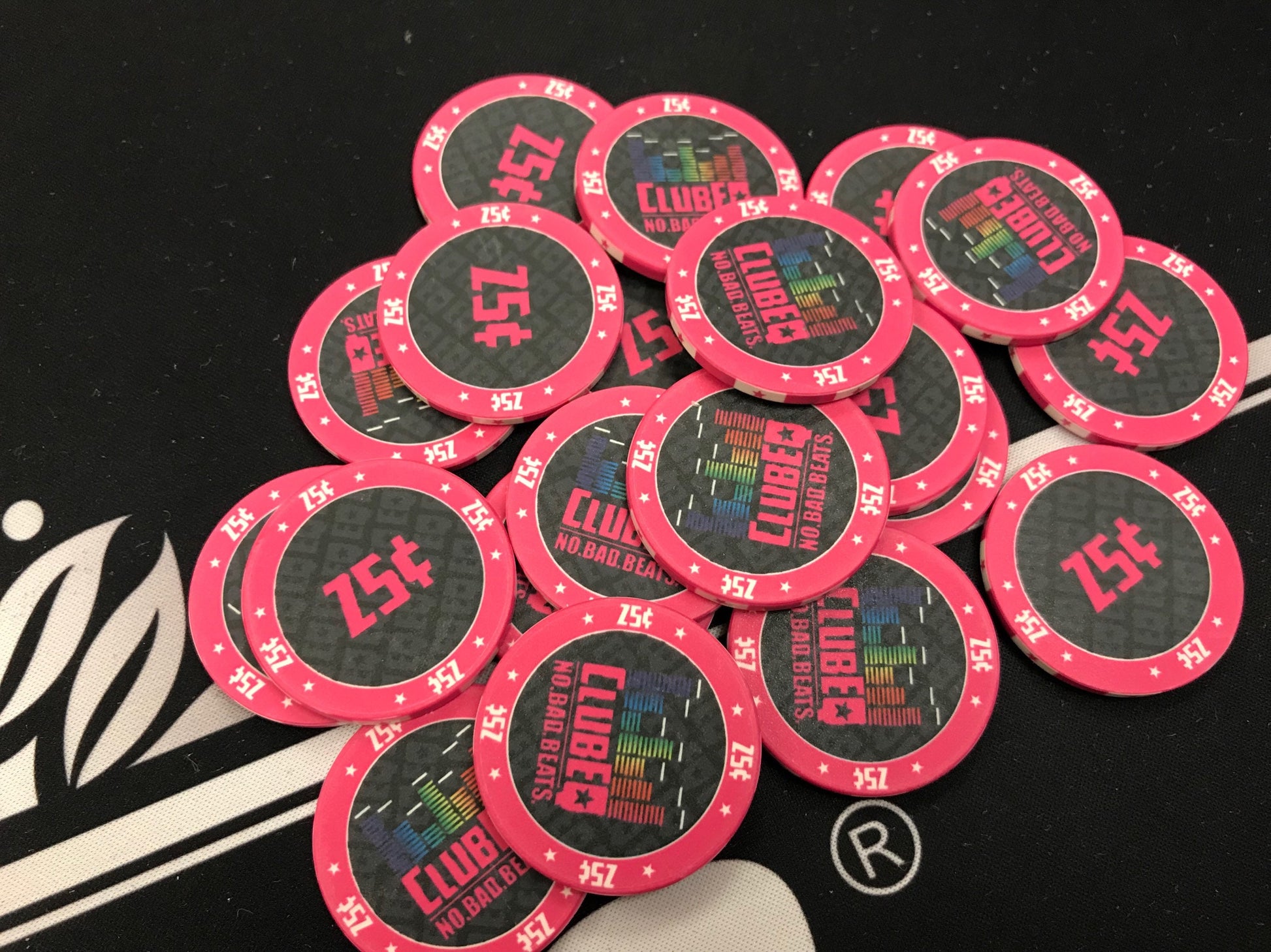 Pink 25¢ (twenty-five cent) ClubEQ poker chips in a pot. These stylish poker chips will liven up your poker game and keep your guests buying back in.