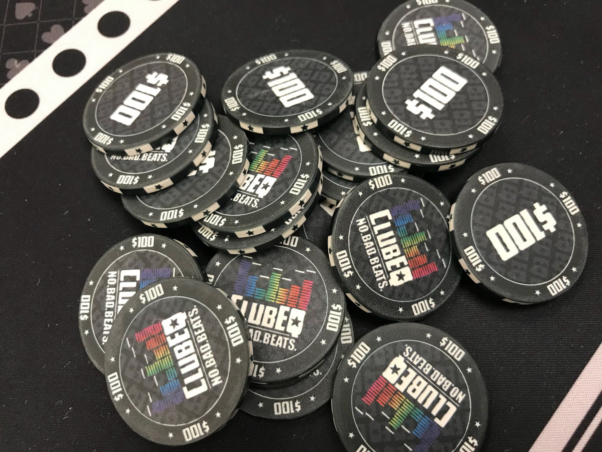 Black $100 (one hundred dollar) ClubEQ poker chips in a pot. These lively poker chips will liven up your pokergame and keep your poker players happy.
